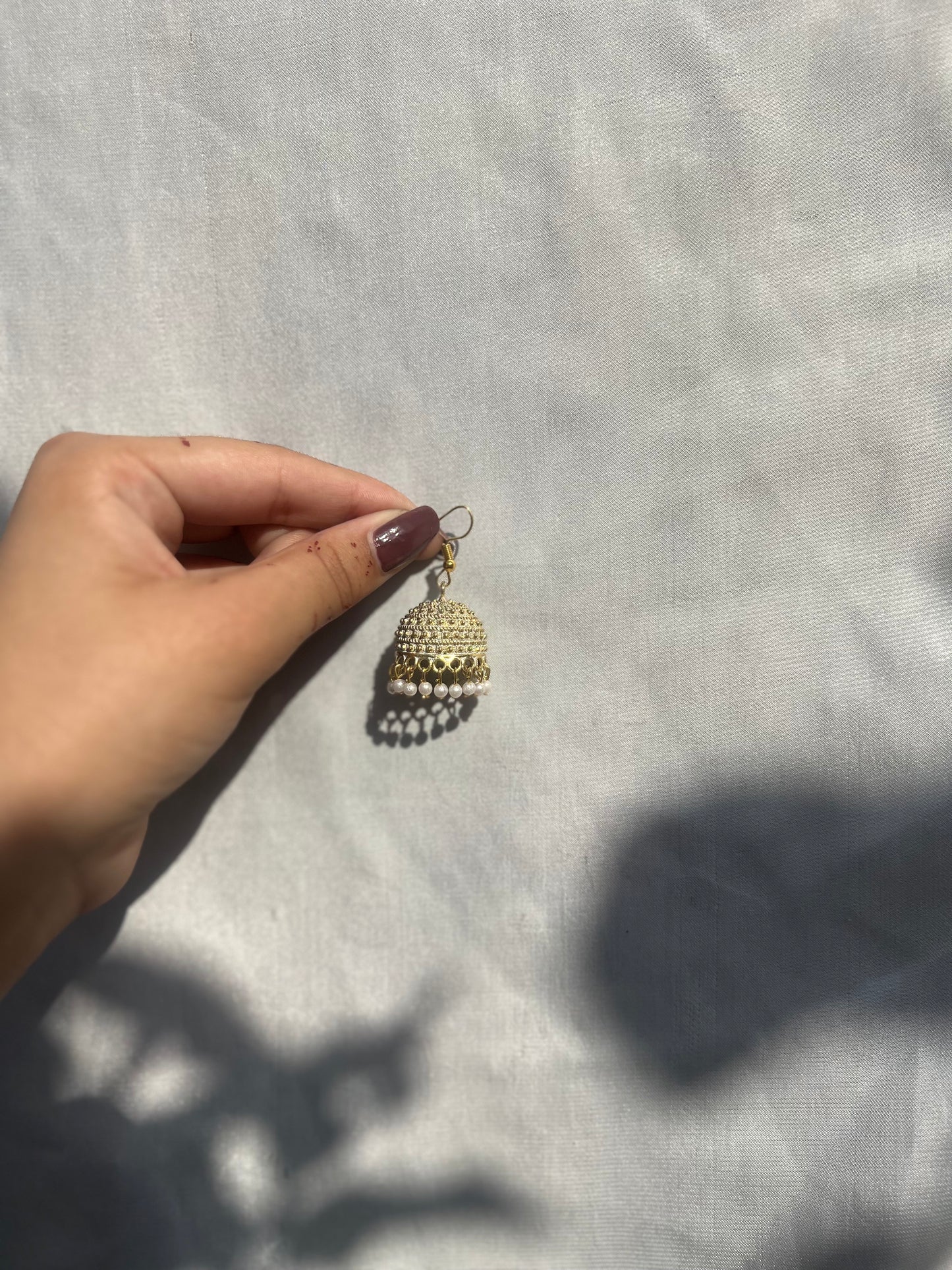 White golden jhumki