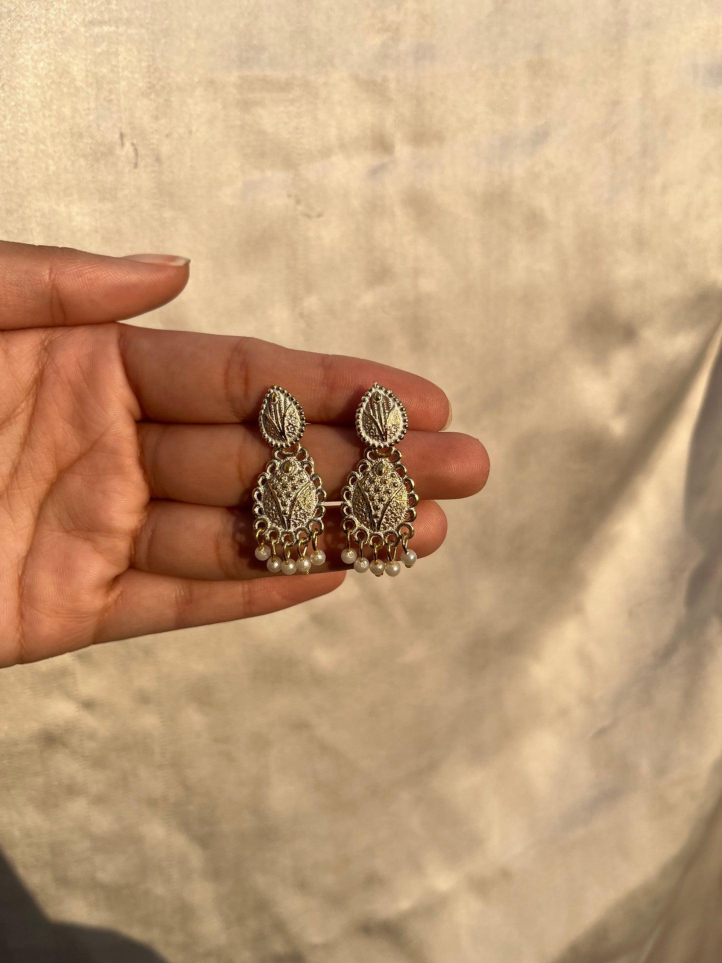 White and golden earpieces