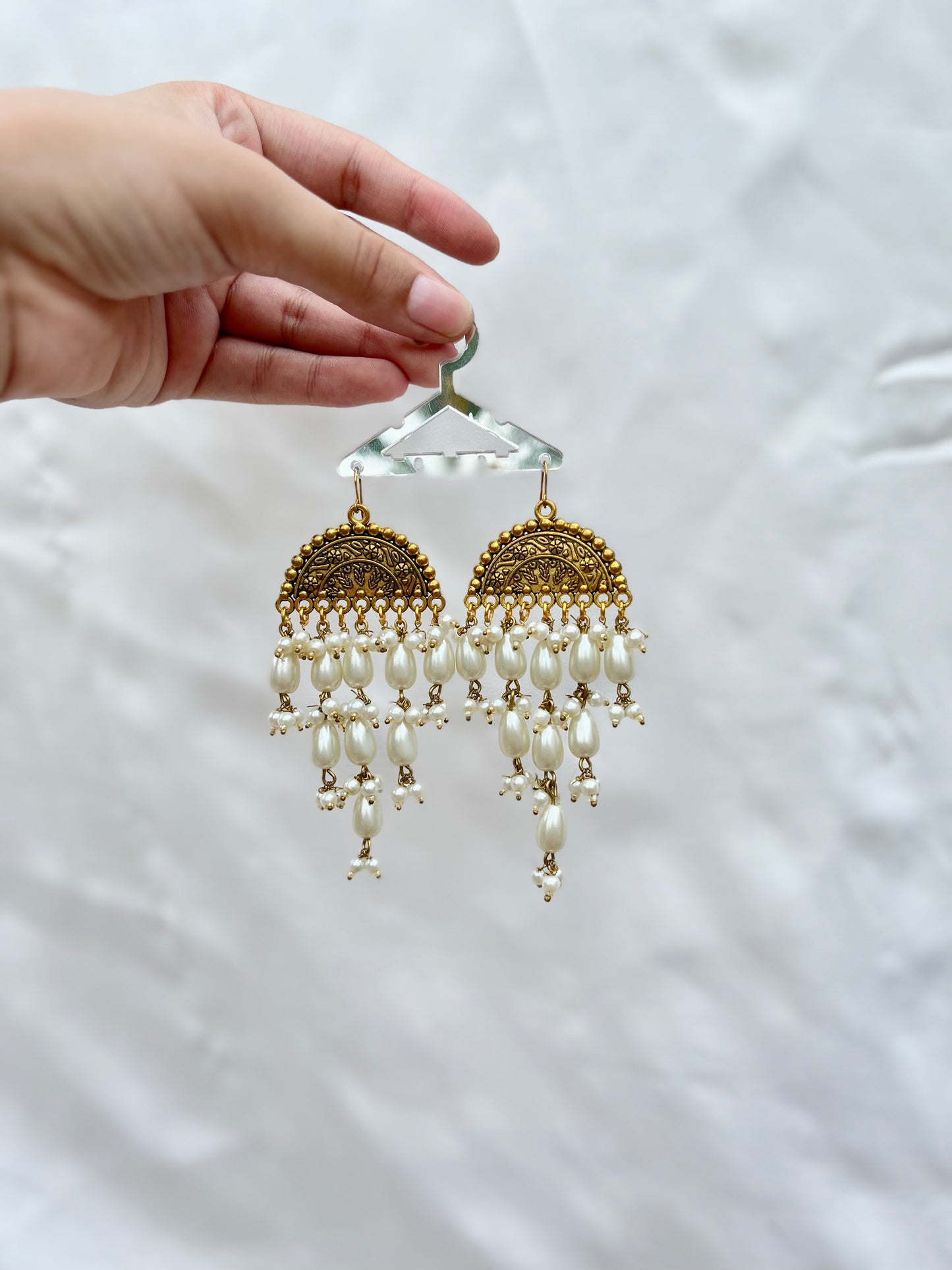 Golden pearled earrings