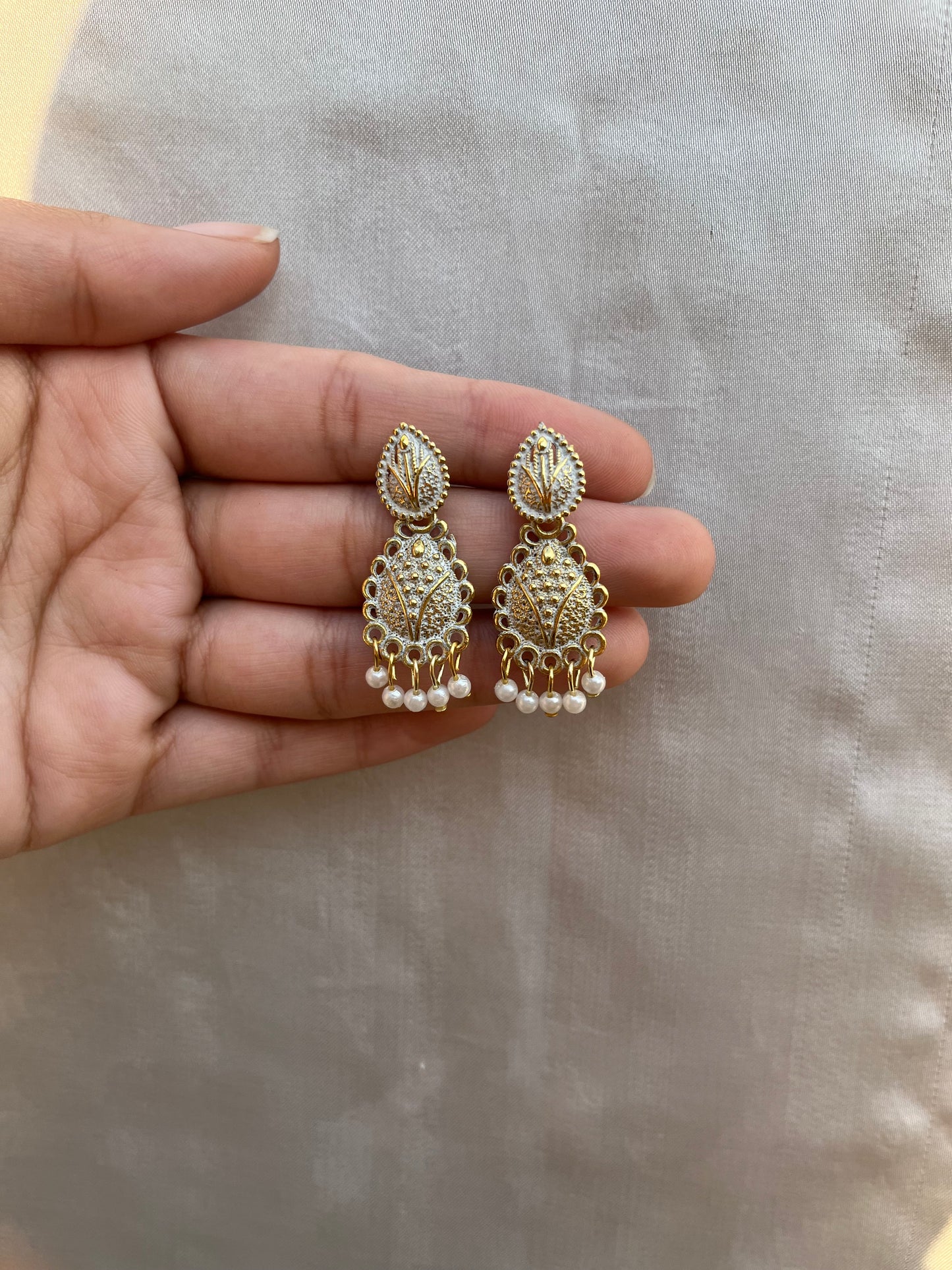 White and golden earpieces