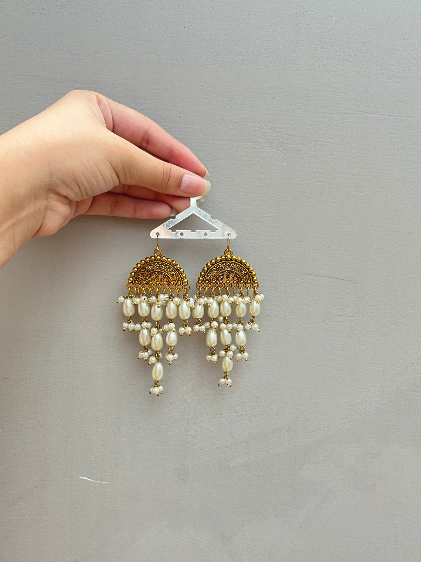Golden pearled earrings