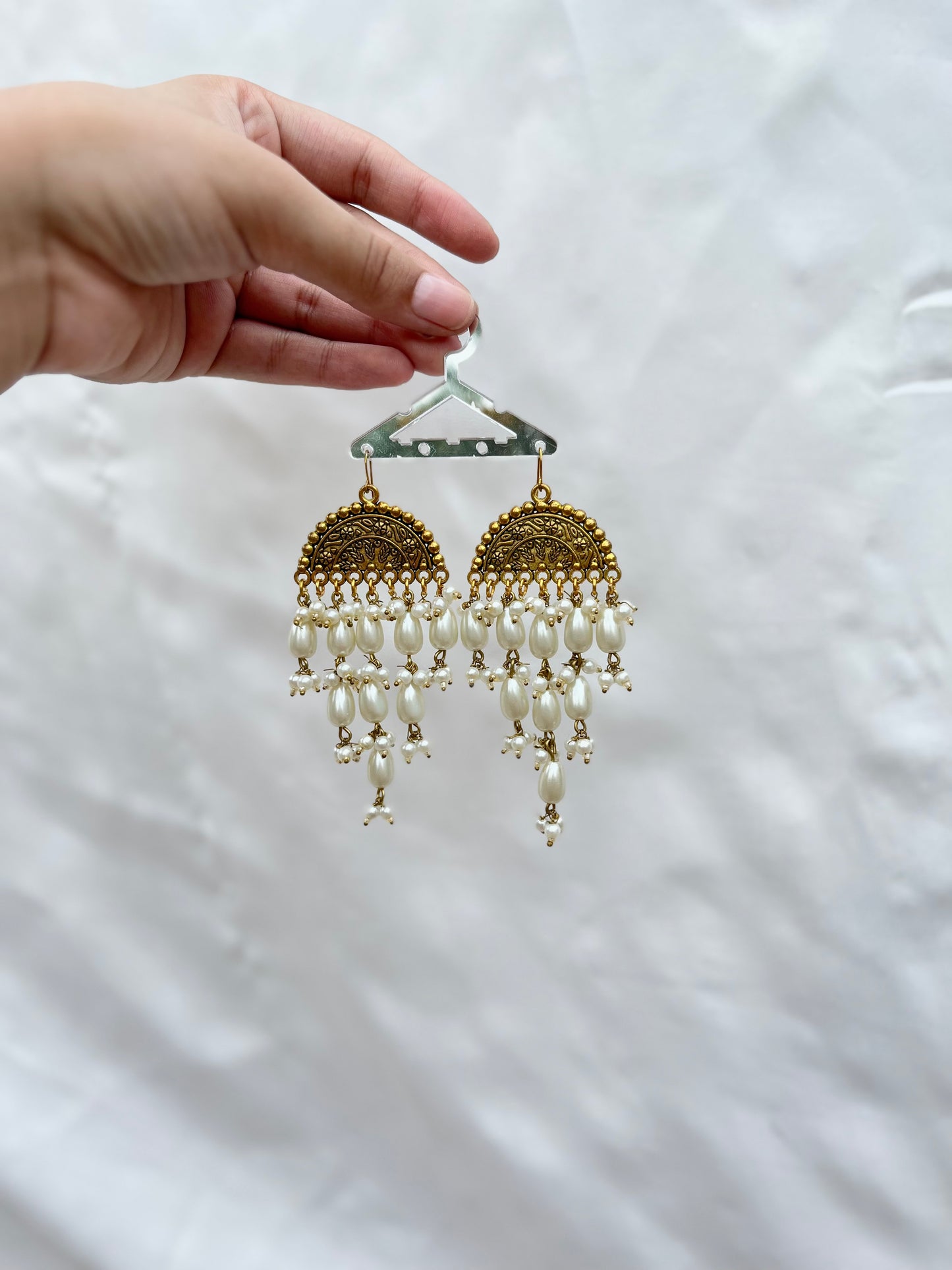 Golden pearled earrings