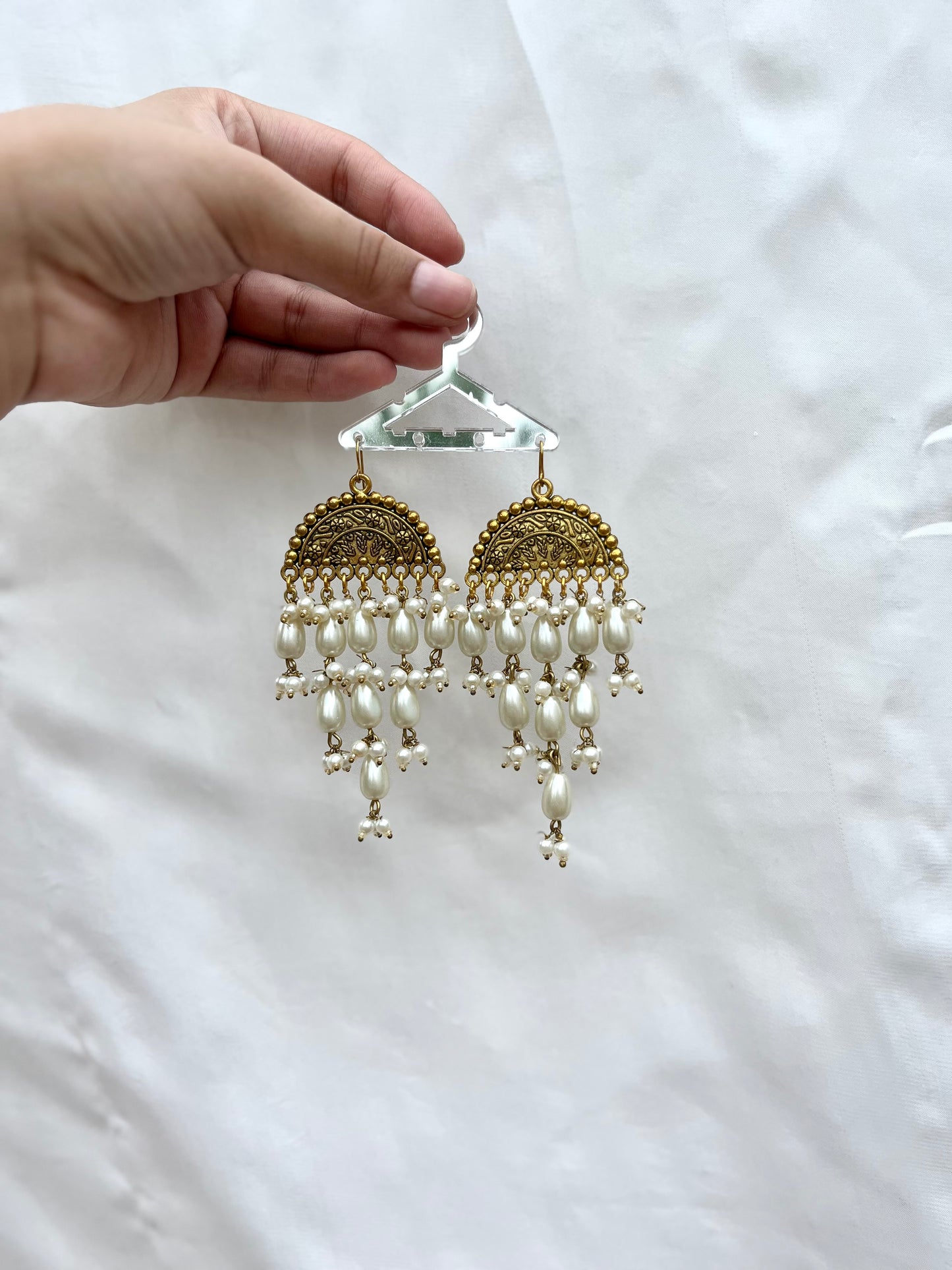 Golden pearled earrings