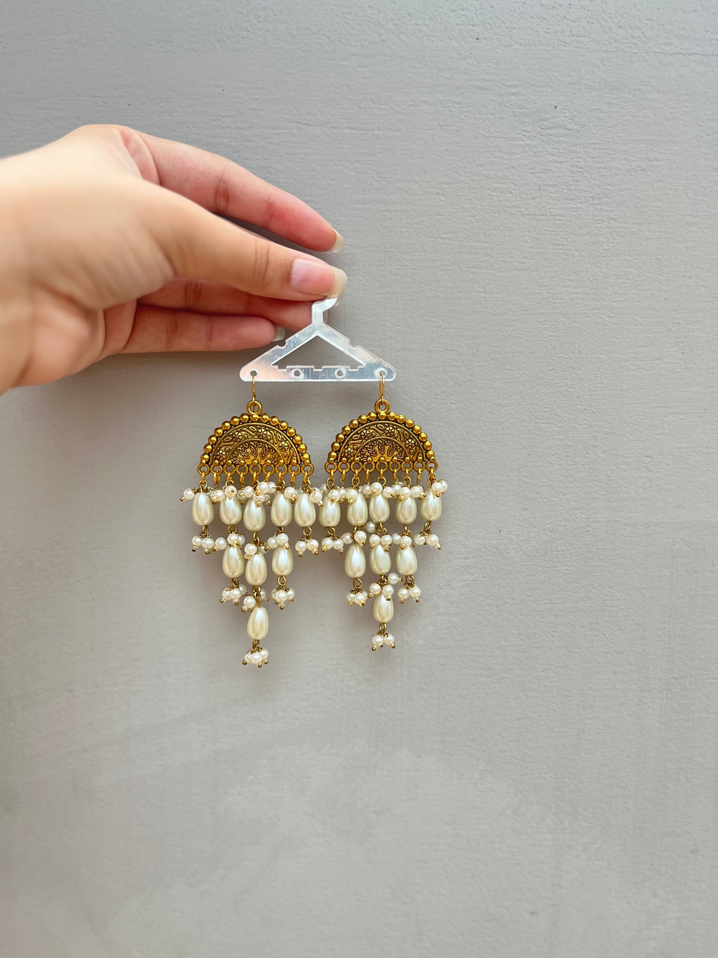 Golden pearled earrings
