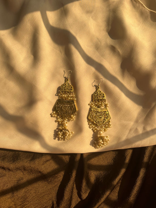 Oversized golden earrings